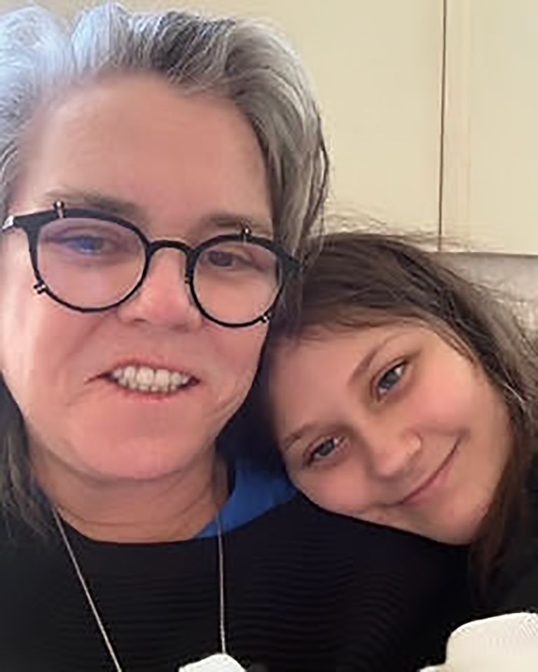 Rosie ODonnell and a young individual smiling