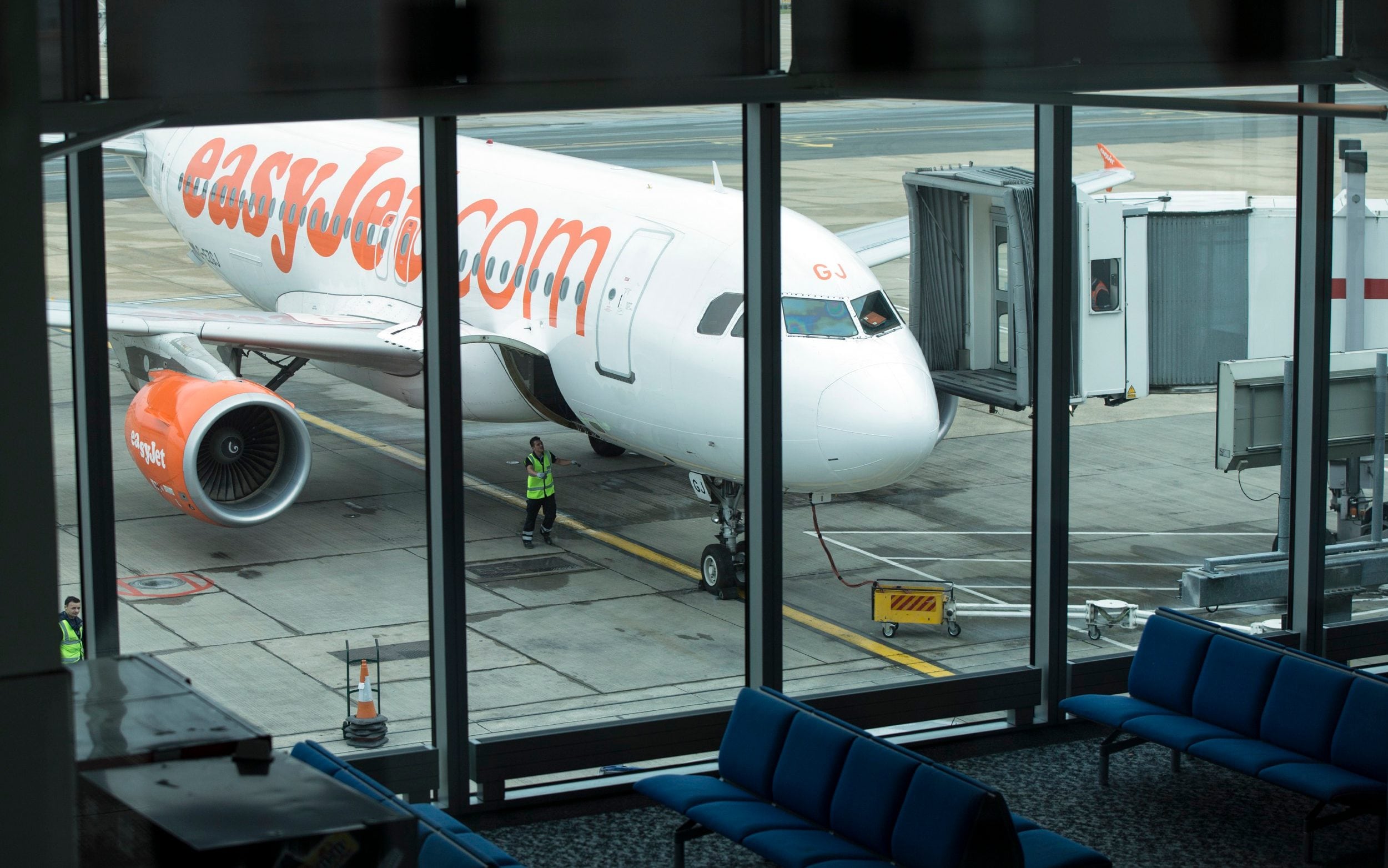 A view of an easyJet aircraft from inside a gate in Gatwick Airport