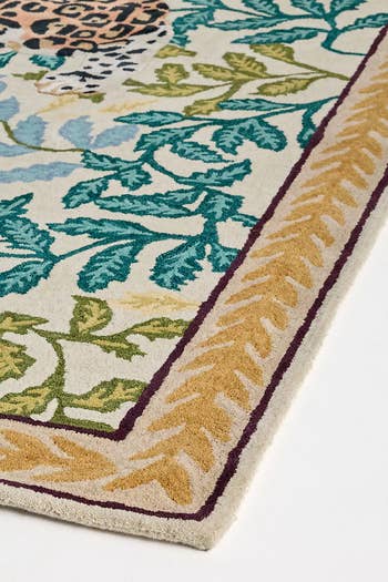 Stylish area rug with leaf and animal print design, suitable for modern interiors. Perfect piece for shoppers seeking bold, eclectic home decor