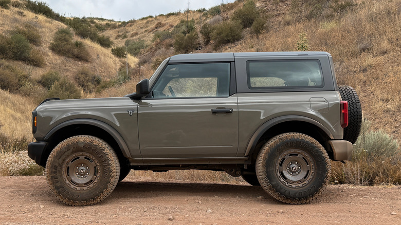 Side photo of Marsh Gray Ford Bronco Sasquatch parked off road