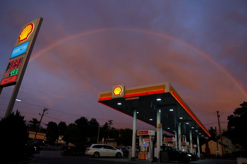 A rainbow forms over a Shell gas station in Randolph