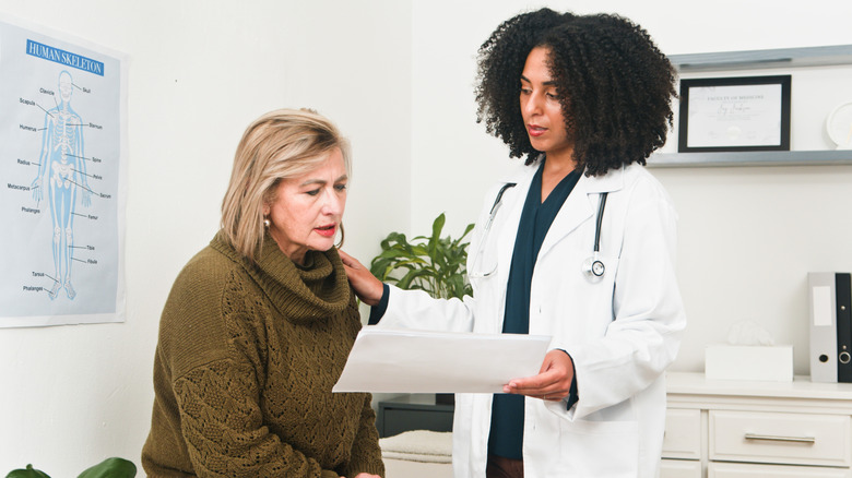 doctor discussing findings with a patient in the office