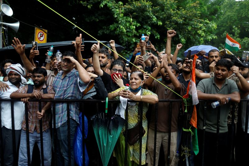 Thousands protest in India after clashes, despite Modi assuring action on exams