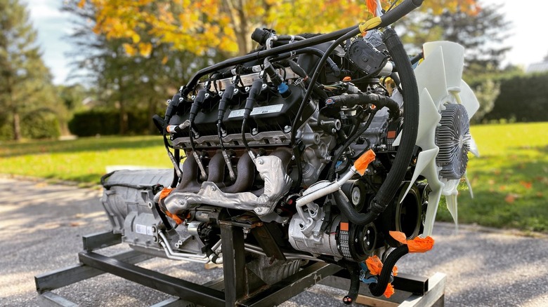 The 7.3 liter Ford Godzilla crate engine on a display stand outside
