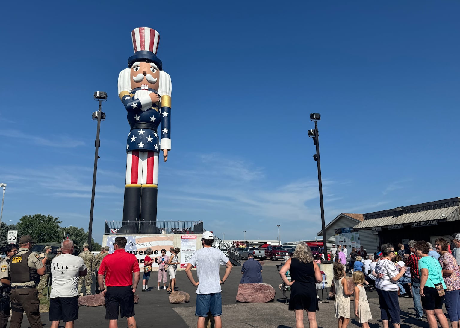 People gather for the ribbon-cutting ceremony for Verne the Patriot in Luverne, Minnesota (Sarah Raza/AP)