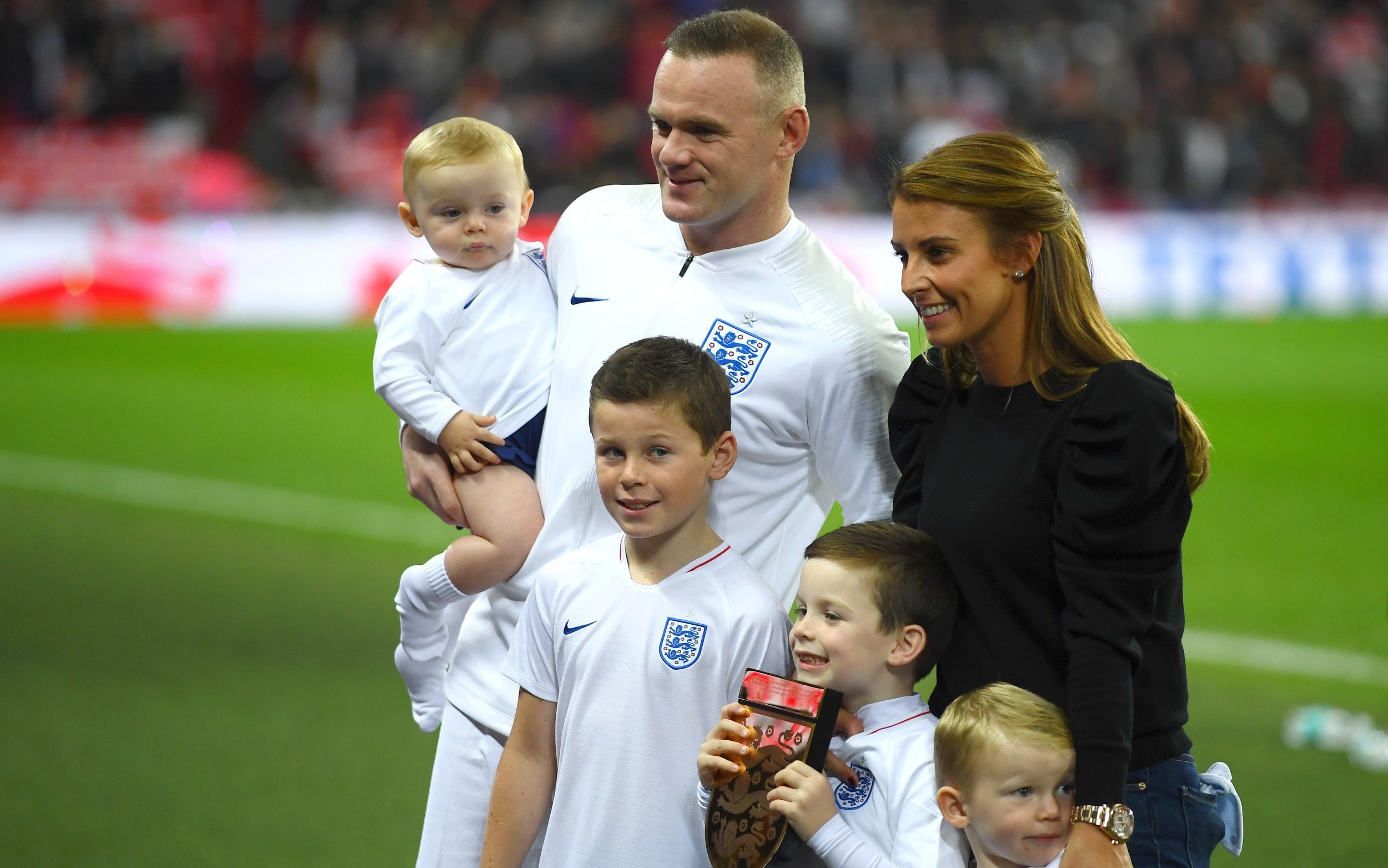 Wayne and Coleen Rooney with their children (from left) Cass, Kai, Klay and Kit in 2018