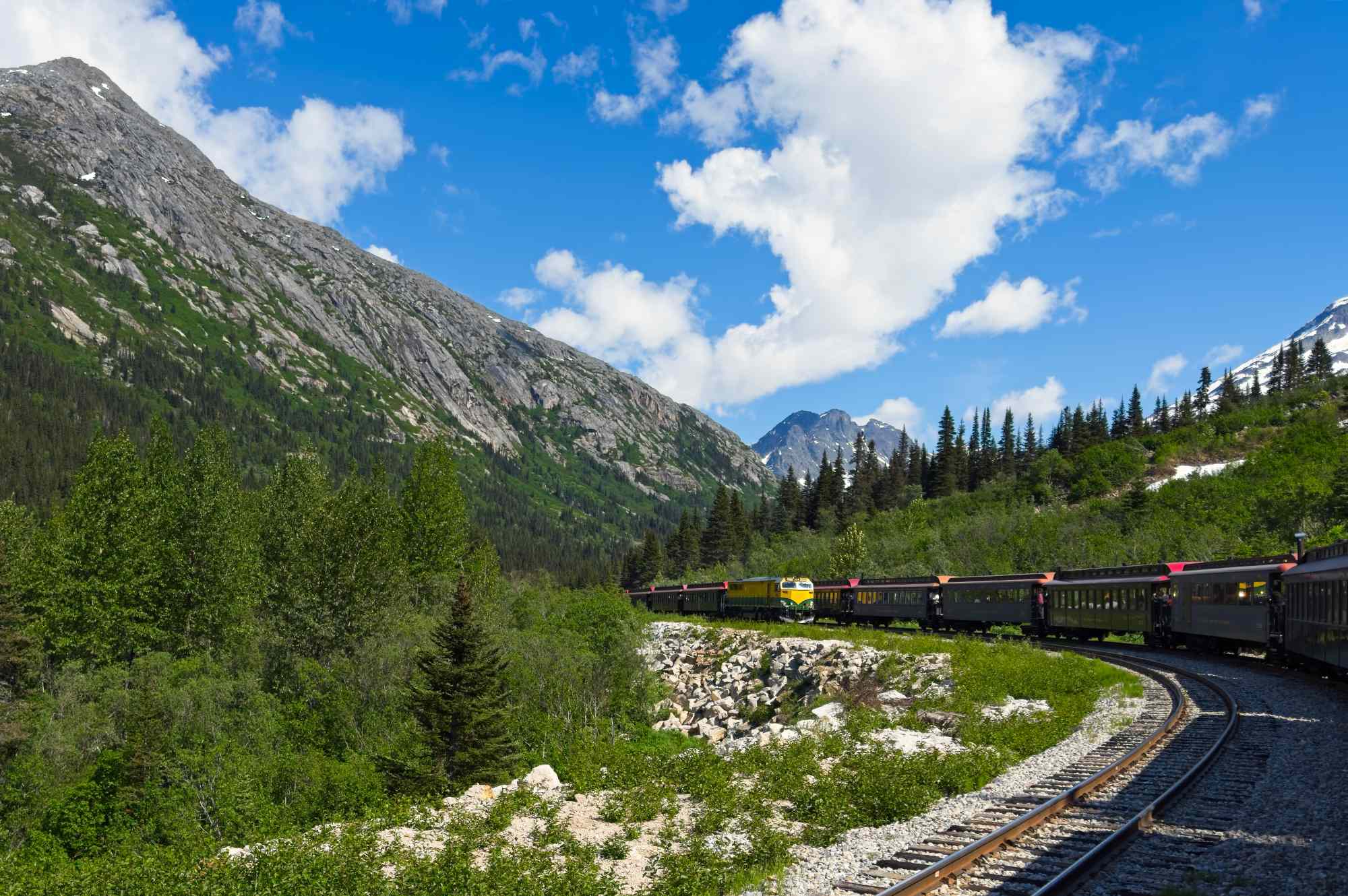 This historic train journey was named Canada’s most scenic—and it passes waterfalls, trestle bridges, and mountain cliffs