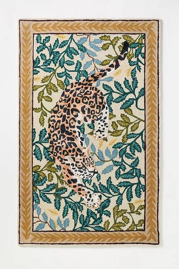 Rug featuring a leopard design with foliage pattern, bordered with a simple leaf motif, suitable for home decor shopping contexts