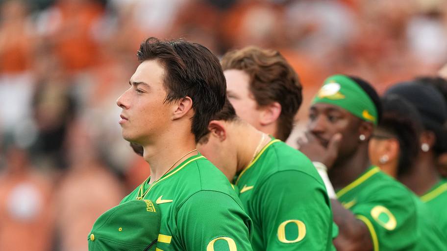 Jun 7, 2026; Austin, TX, USA; Oregon Ducks players stand for the national anthem before a Super Regional game against the Tex