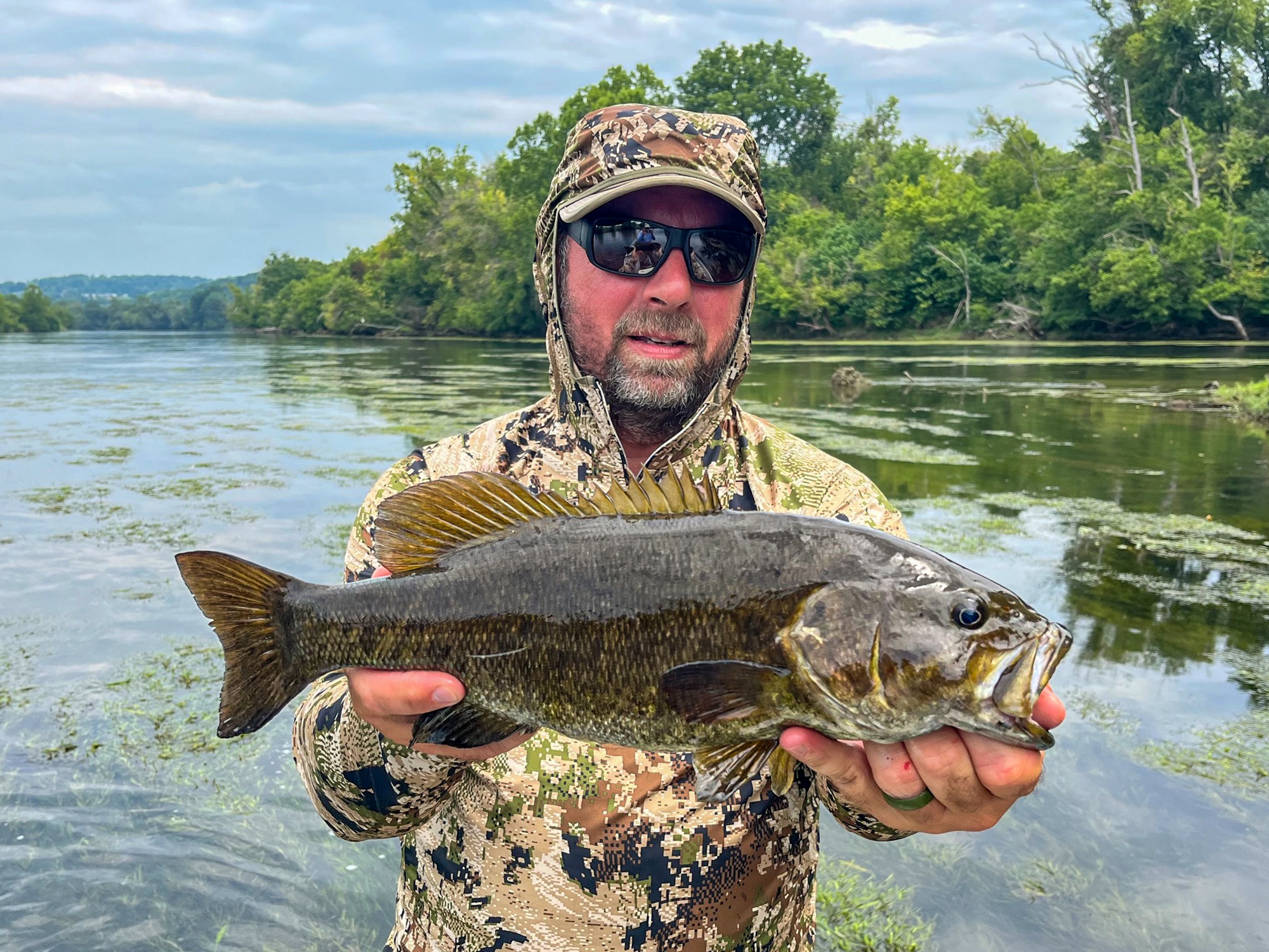 Guide Jacob Ott with a smallmouth on West Virginia's Greenbrier River.