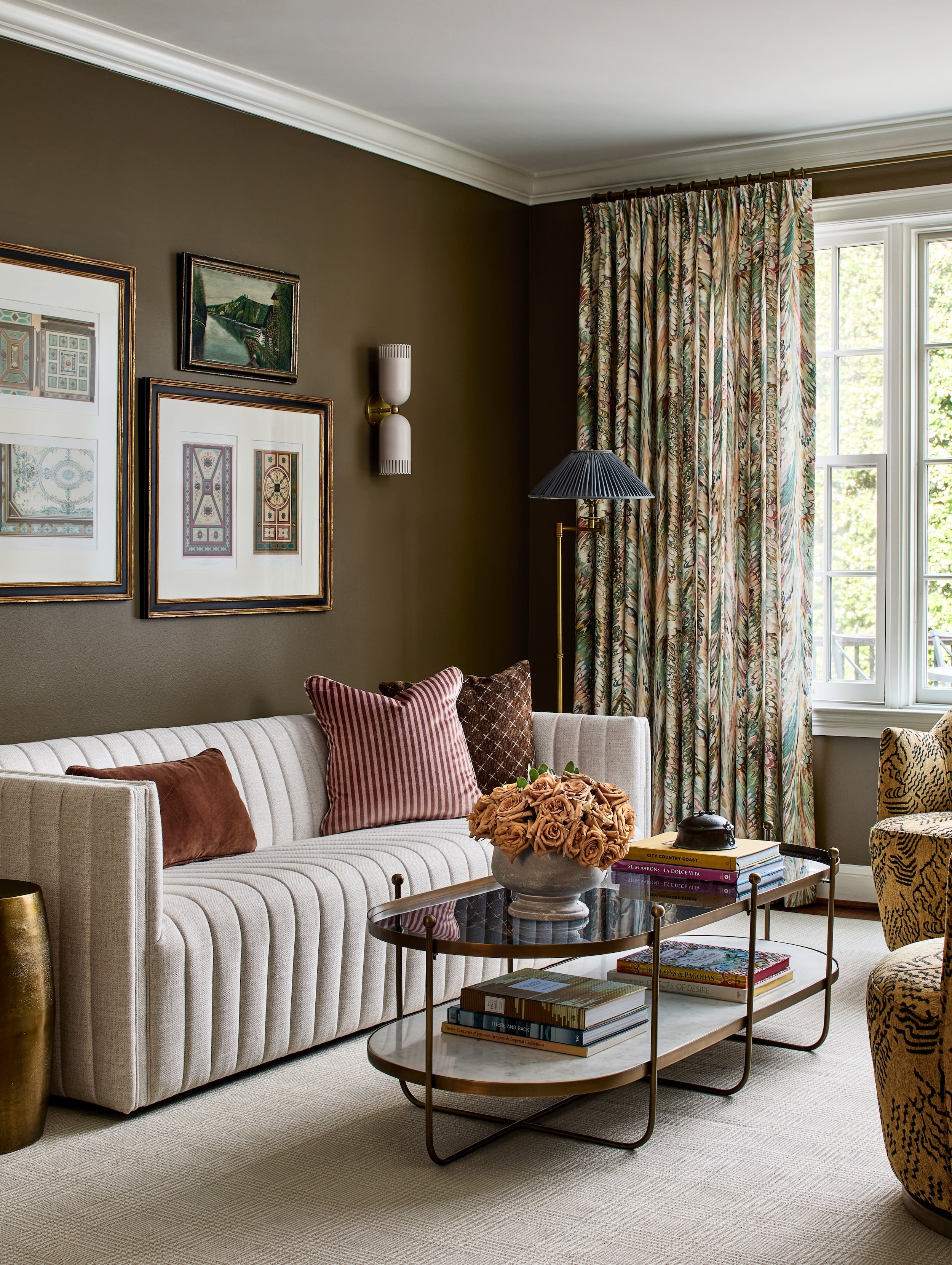 Layers of texture and patterns come together in the den.