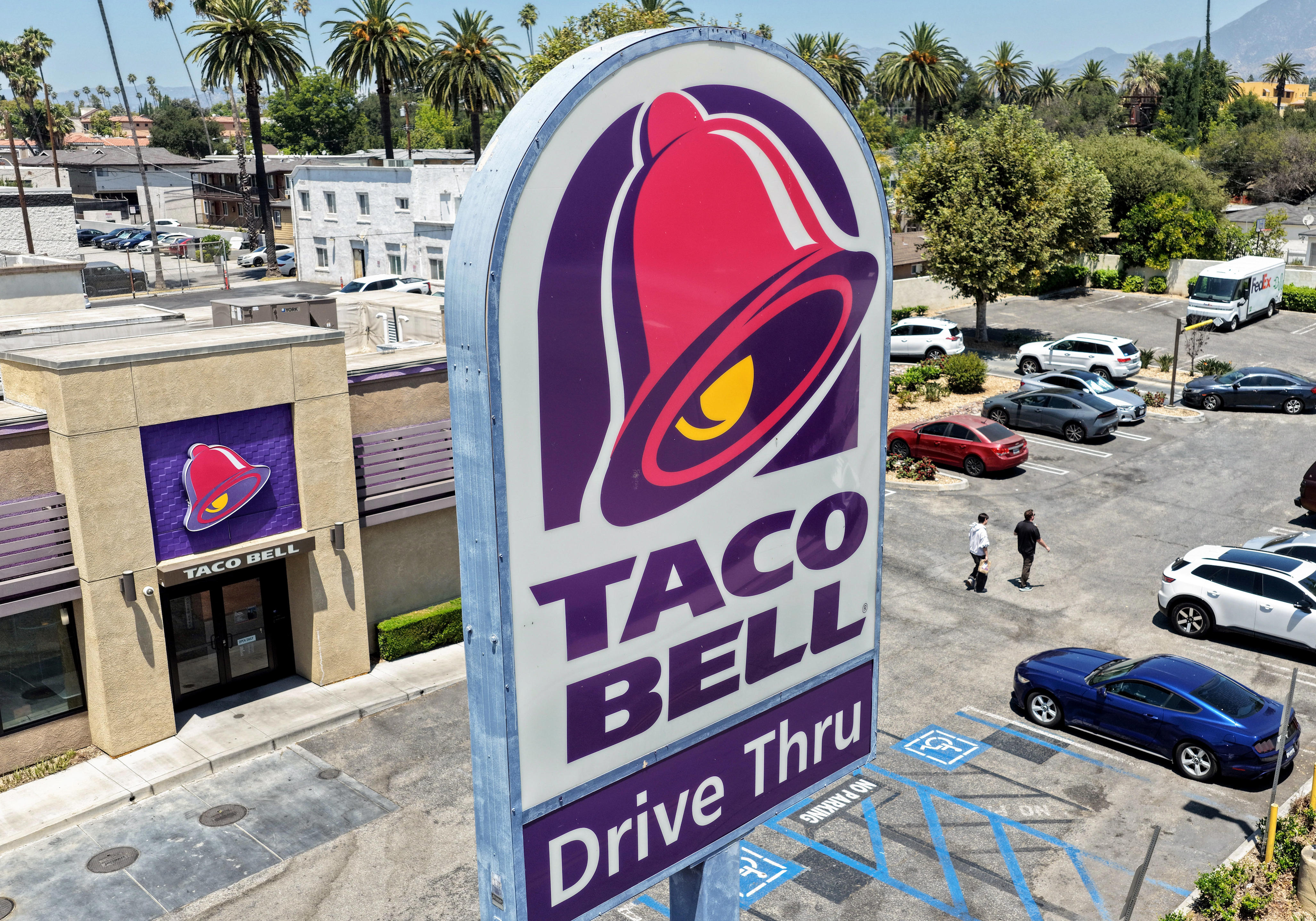 In an aerial view, customers depart a Taco Bell restaurant on July 14, 2026 in Pasadena, California.