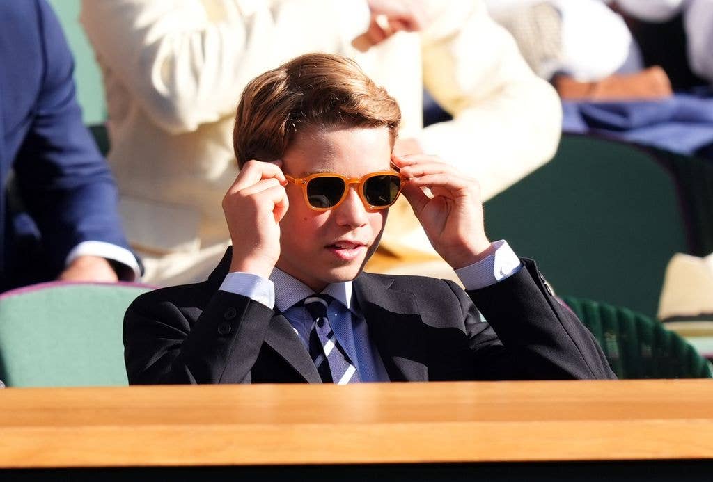 Prince George plays tennis among other sports
