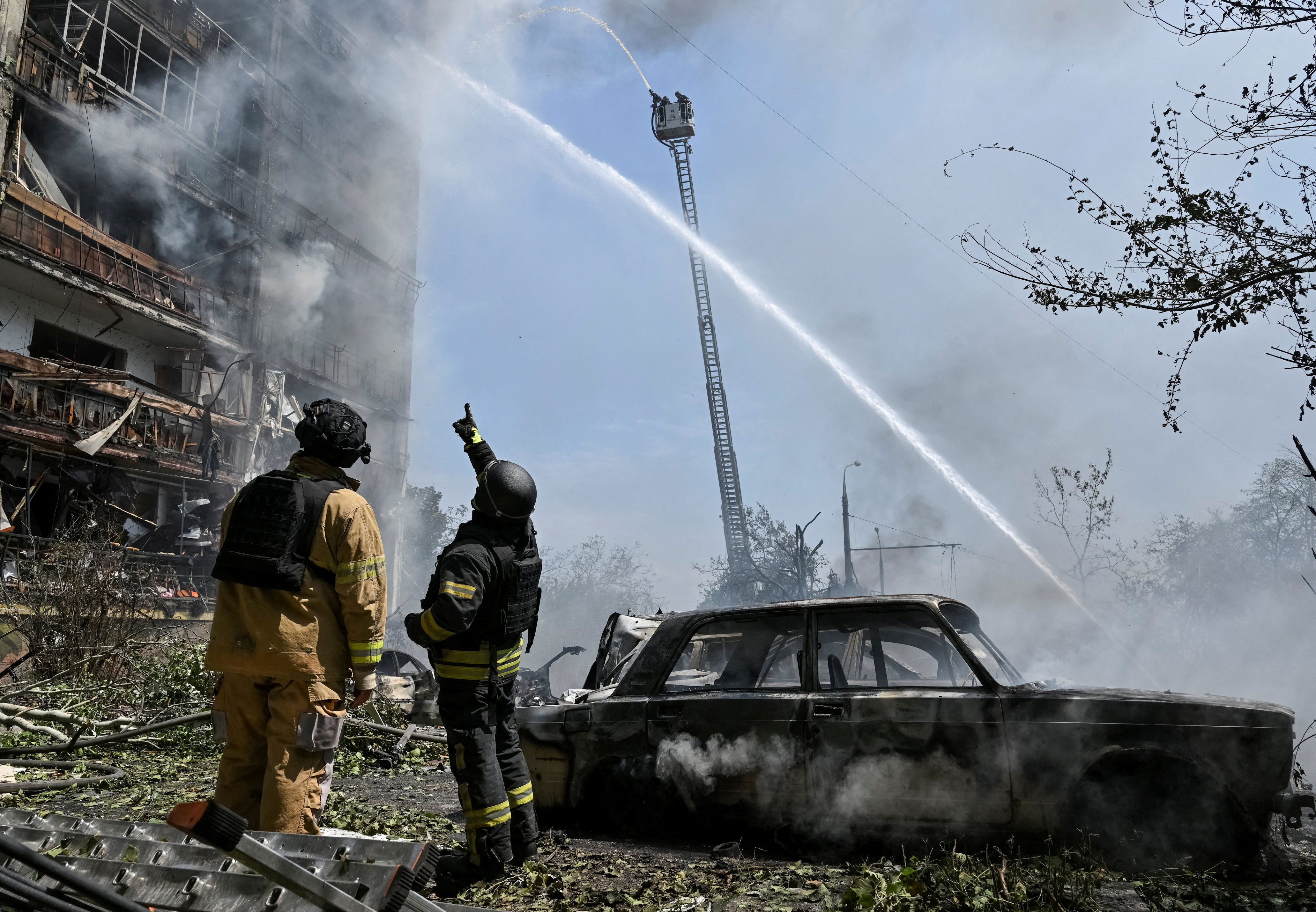 Rescuers work at a site of an apartment building hit by Russian air strike, amid Russia's attack on Ukraine, in Zaporizhzhia (Reuters)