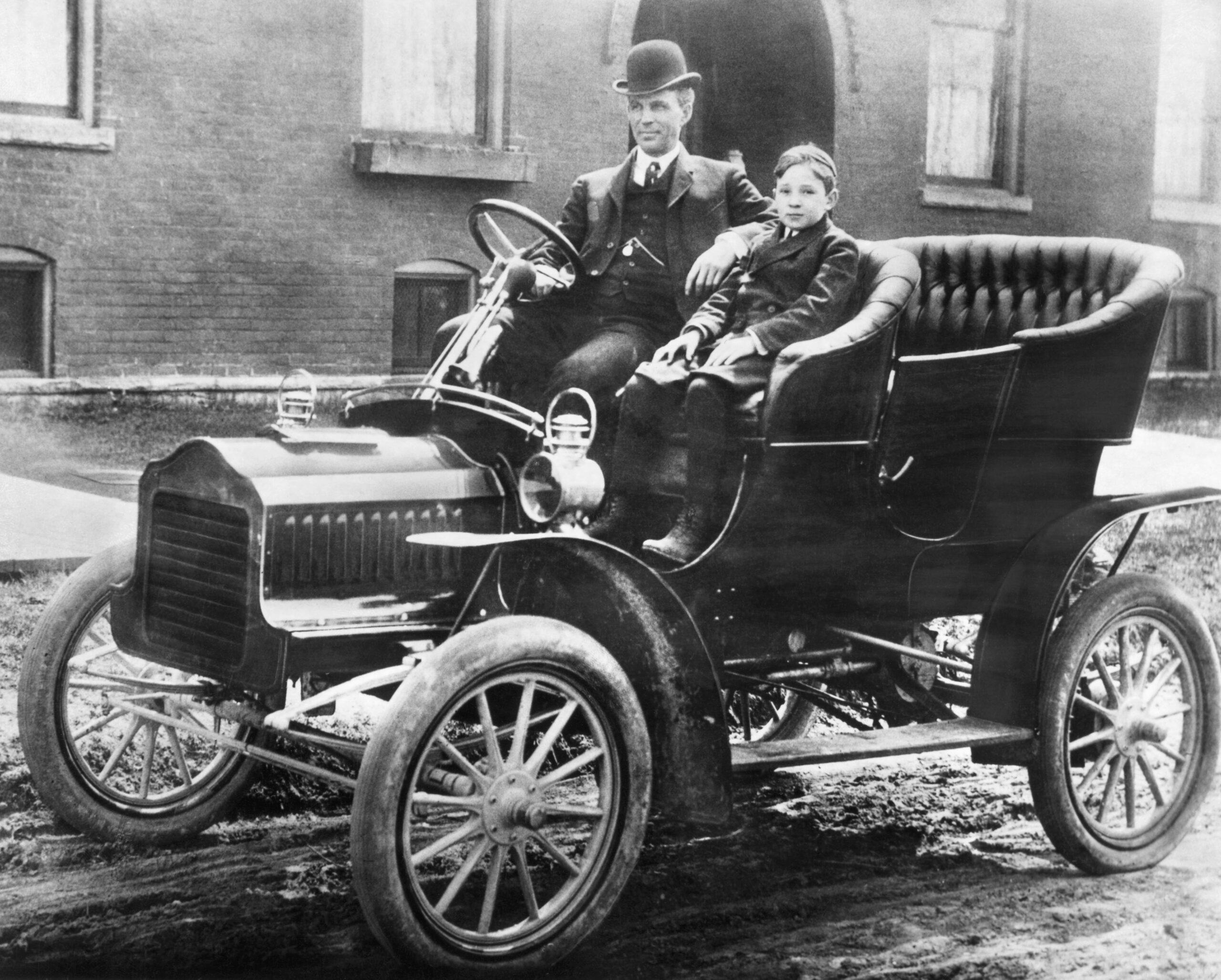 Father Henry and Son Edsel Ford sit in the rare Model F Ford