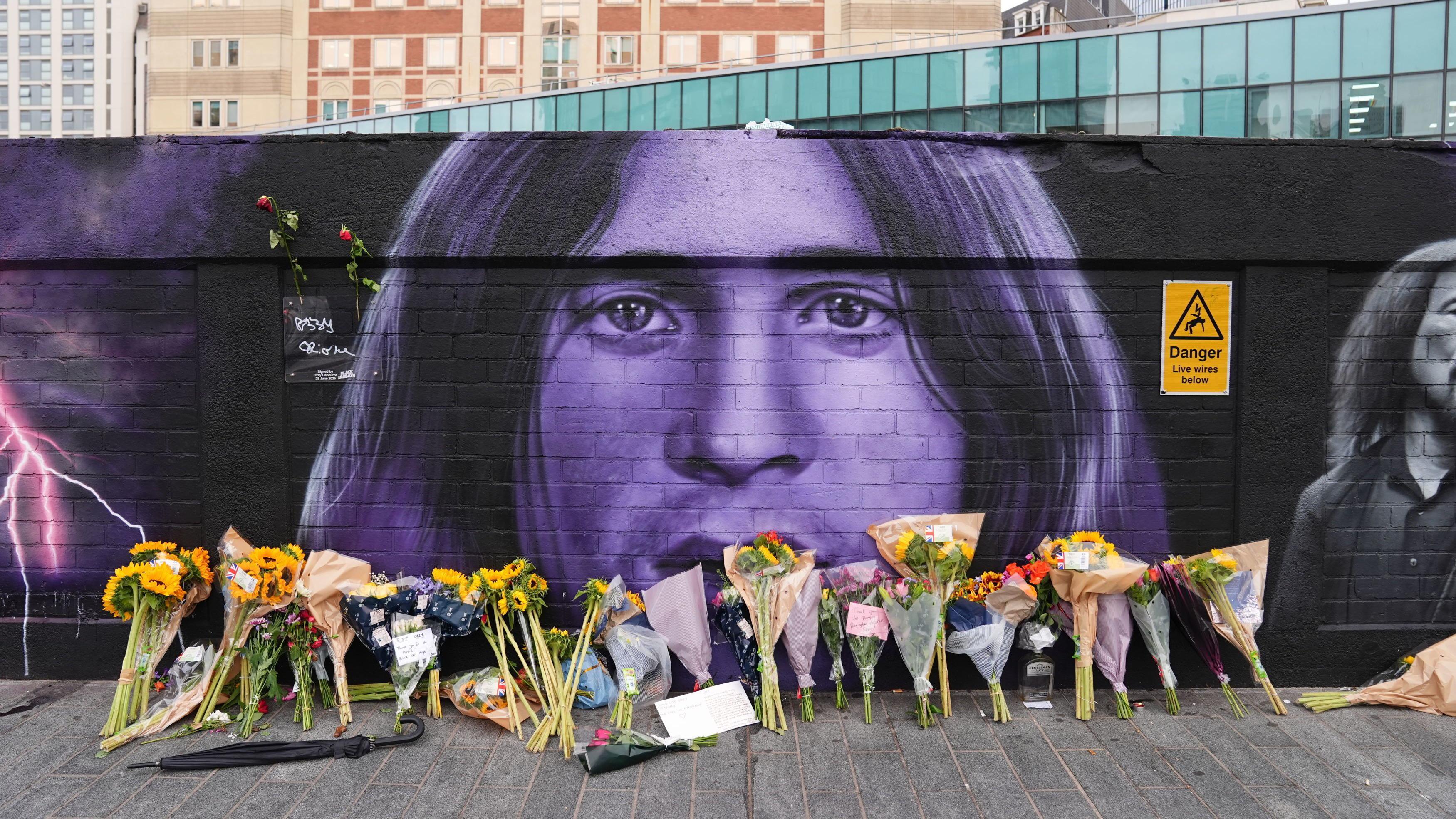 Floral tributes have been by the Black Sabbath mural on Navigation Street in Birmingham, following the death of frontman Ozzy Osbourne