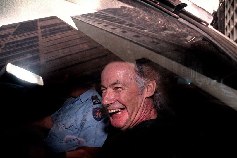 Ivan Milat laughs as he leaves court after representing himself in his appeal against conviction for seven murders — he is thought to have committed many more