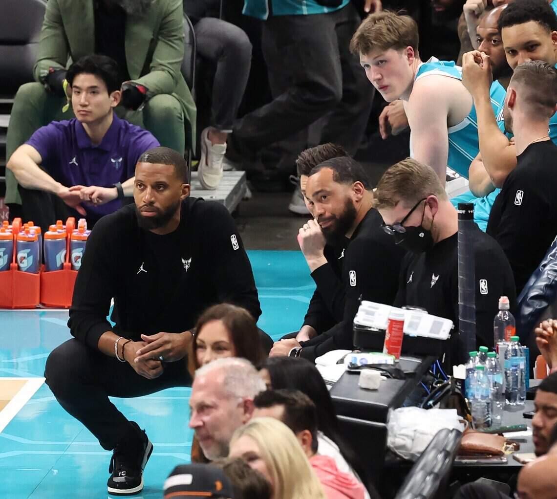 Charlotte Hornets head coach Charles Lee, left, watches the team battle the Orlando Magic during action at Spectrum Center in Charlotte, NC on Thursday, March 19, 2026.