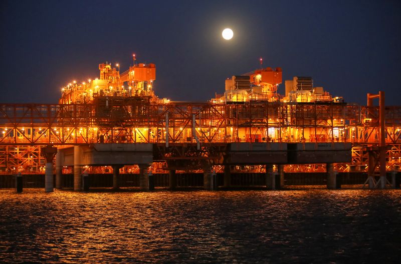 FILE PHOTO: The full moon rises in the background over the infrastructure on D Island, the main processing hub, at the Kashagan offshore oil field in the Caspian sea in western Kazakhstan