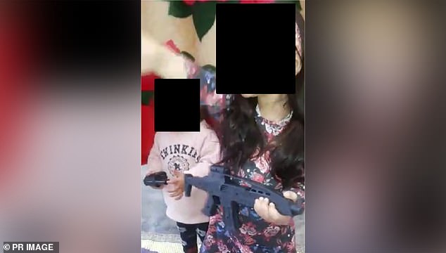 El Houli allegedly encouraged her two-year-old toddler to act like an ISIS fighter while holding a toy rifle