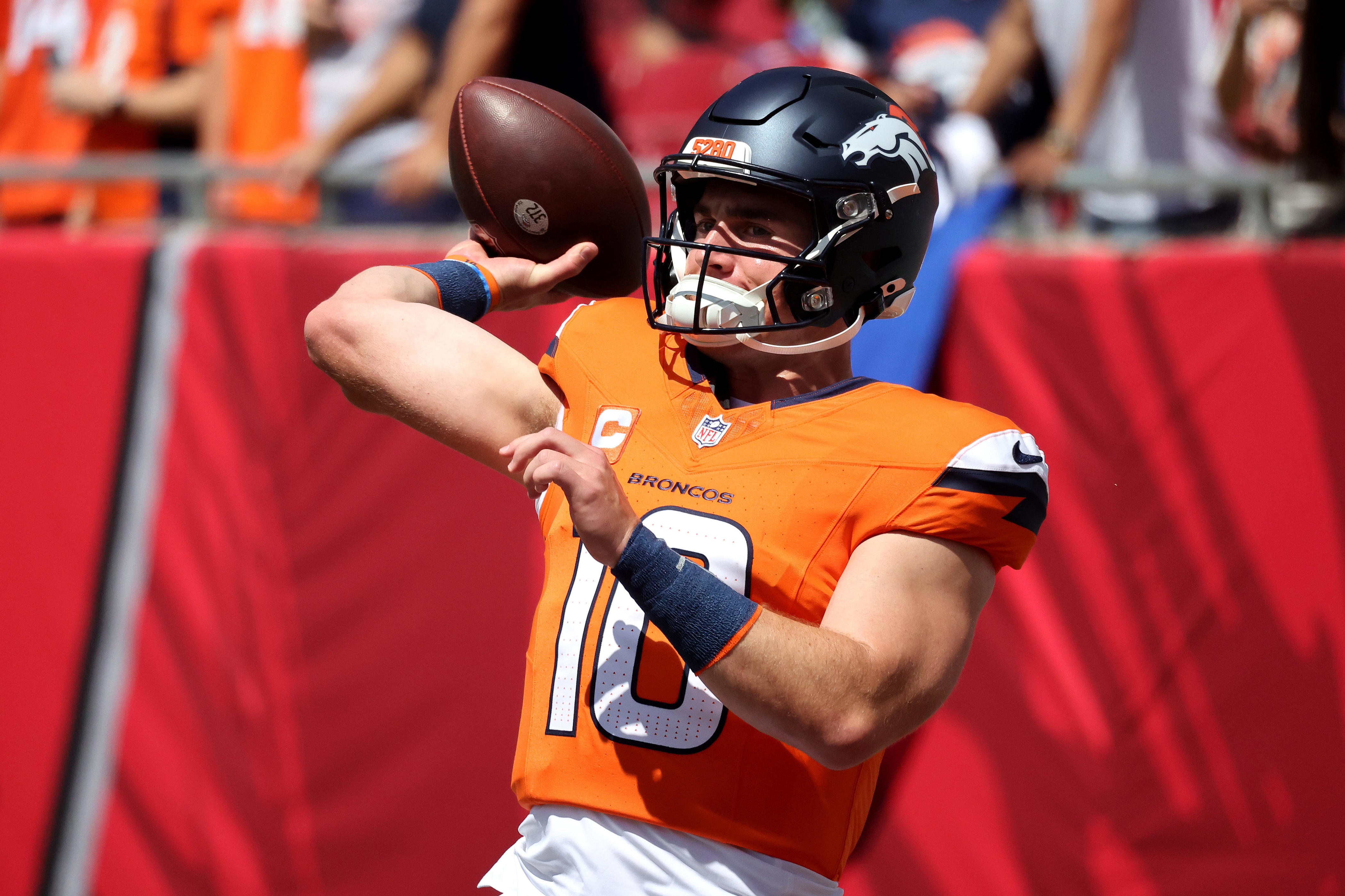 TAMPA, FLORIDA - SEPTEMBER 22: Quarterback Bo Nix #10 of the Denver Broncos throws a pass during pregame warm ups prior to playing the Tampa Bay Buccaneers at Raymond James Stadium on September 22, 2024 in Tampa, Florida. (Photo by Mike Carlson/Getty Images)