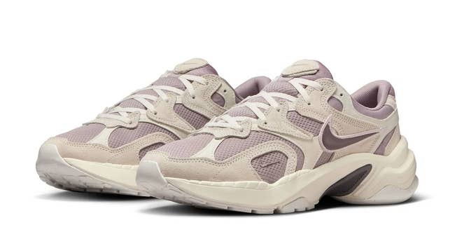 Fashionable athletic sneakers with a sleek, modern design featuring mesh and leather details, ideal for casual and active wear