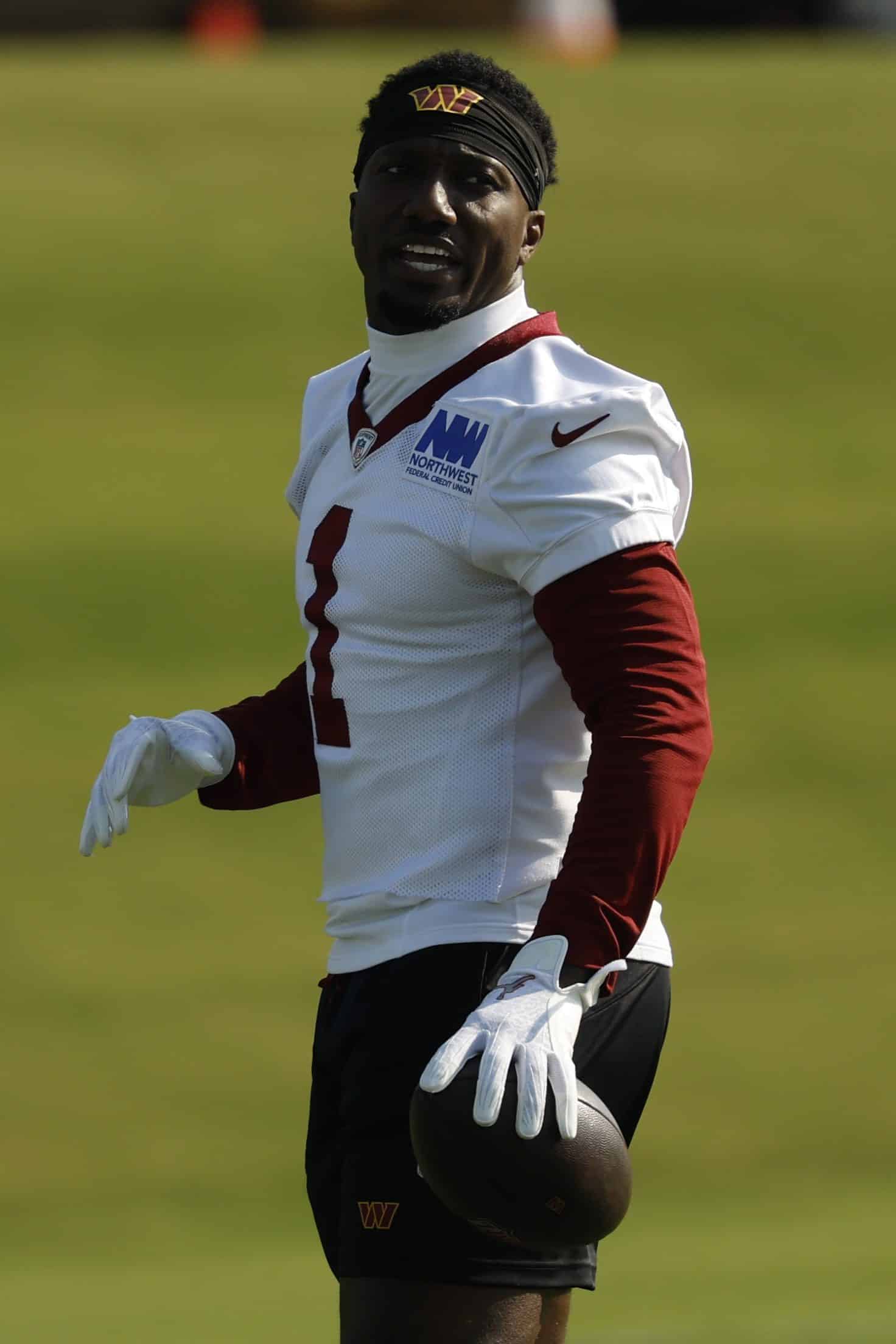 Jul 24, 2025; Ashburn, VA, USA; Washington Commanders wide receiver Deebo Samuel Sr. (1) stands on the field during warmup prior to practice on day two of training camp at OrthoVirginia Training Center at Commanders Park. Mandatory Credit: Geoff Burke-Imagn Images