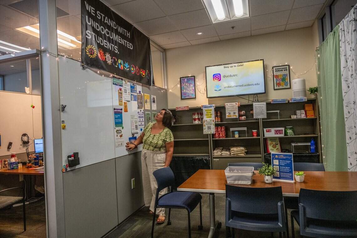 Daniela De La Cruz Telles looks toward a banner inside the Undocumented Student Resource Center at UC Davis on Monday, July 20, 2026.