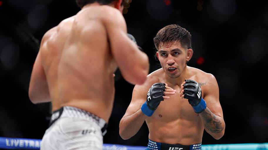 Austin Bashi (red gloves) fights Jose Miguel Delgado (blue gloves) during UFC Fight Night at Paycom Center.