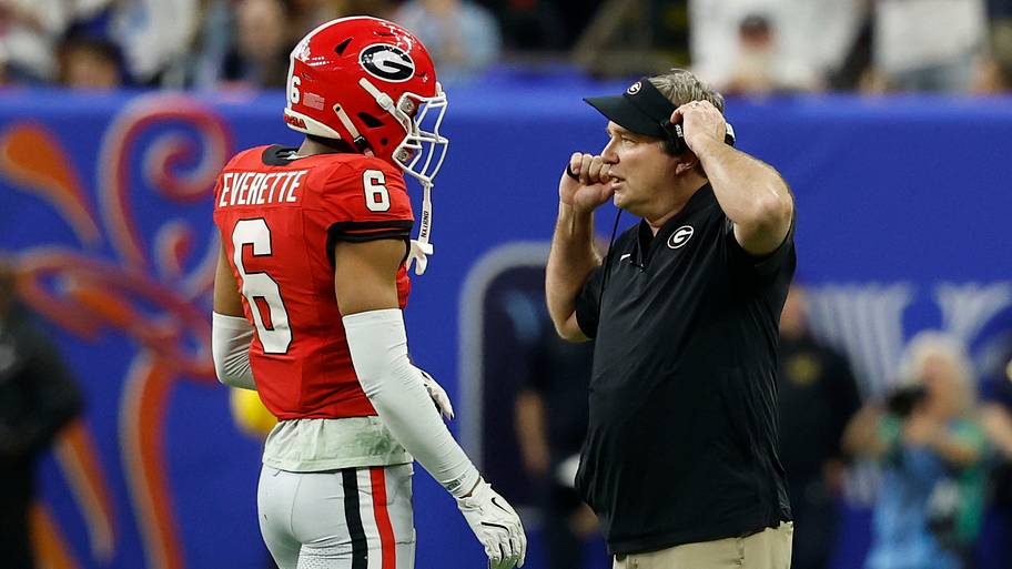 Mississippi Rebels quarterback Trinidad Chambliss (6) talks with Bulldogs head coach Kirby Smart