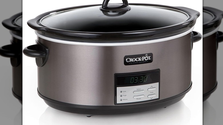 Grey slow cooker with panel of buttons on front