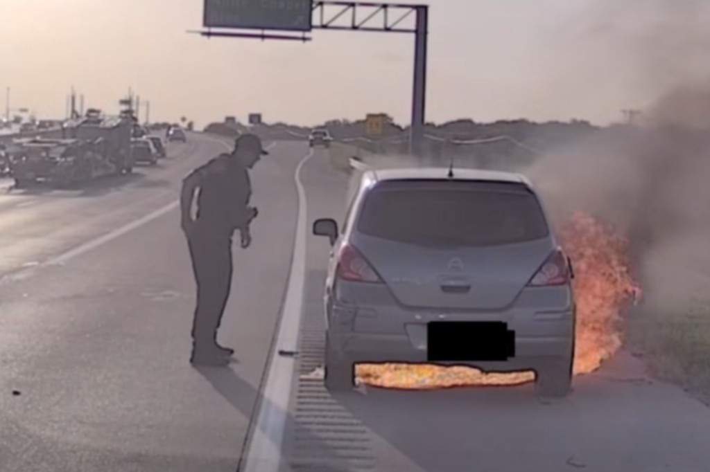 On June 7, an officer pulled a driver to safety after their vehicle erupted in flames.