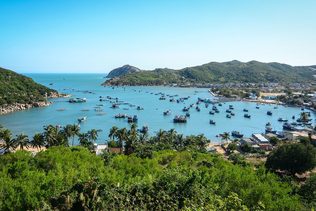 Beautiful sea with many wooden boats in Nha Trang Bay, southern Vietnam.
