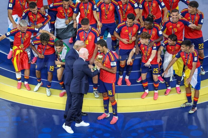 Donald Trump and Gianni Infantino hand the World Cup trophy to Spain captain Rodri