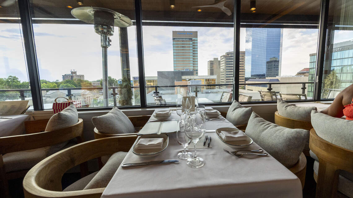 The dining room at The V at the Vine has great views of downtown Lexington, nine stories up. The V also has a members only pool, spa, lounge and more, but the restaurant is open to the public.