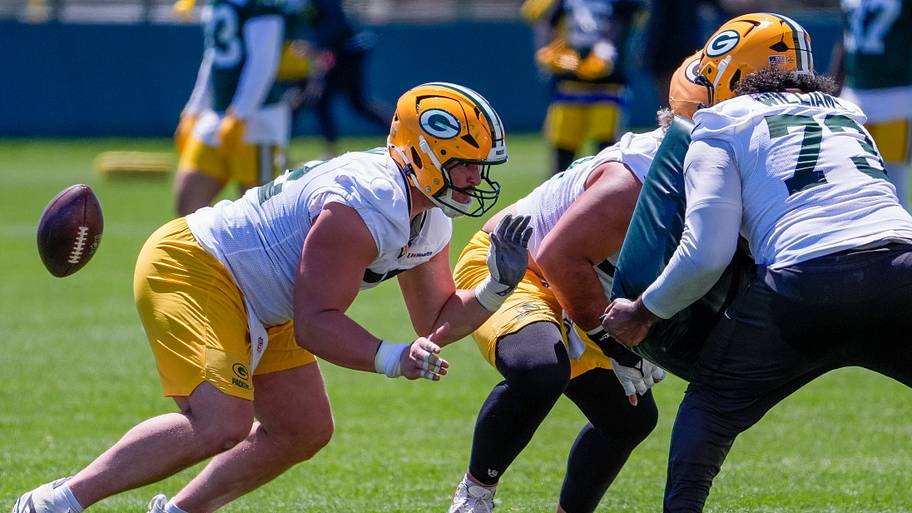 Green Bay Packers offensive lineman Jager Burton snaps the ball during OTAs.