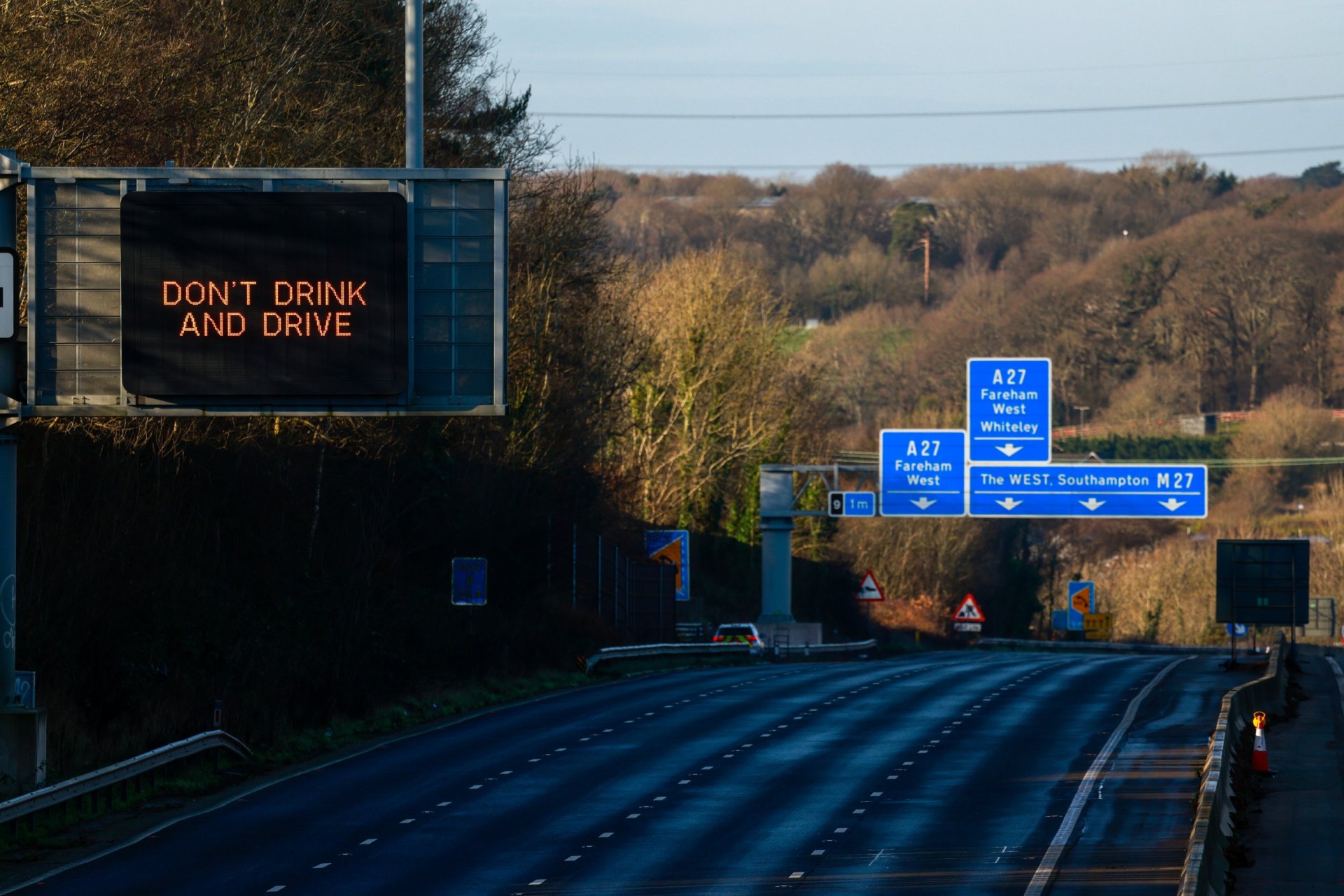 A 'Don't Drink and Drive' sign above an empty section of the closed M27 motorway during improvement works in near Fareham, UK, on Tuesday, Dec. 30, 2025. The carriageways between junctions 9 and 10 on the M27 will be closed for improvements until Jan. 4. Photographer: Jason Alden/Bloomberg via Getty Images