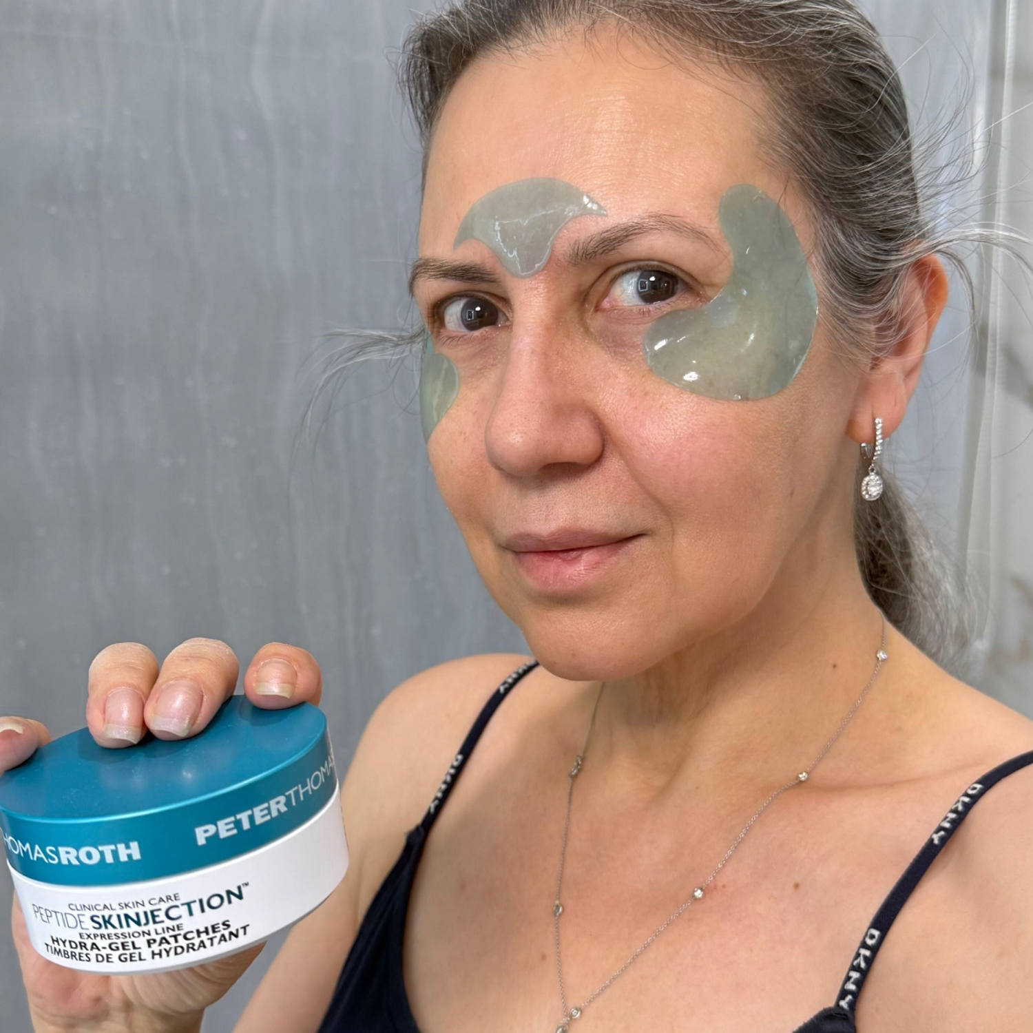 Julia Moon tries the Peter Thomas Roth Peptide Skinjection™ Expression Line Hydra-Gel Patches. (Courtesy of Julia Moon)