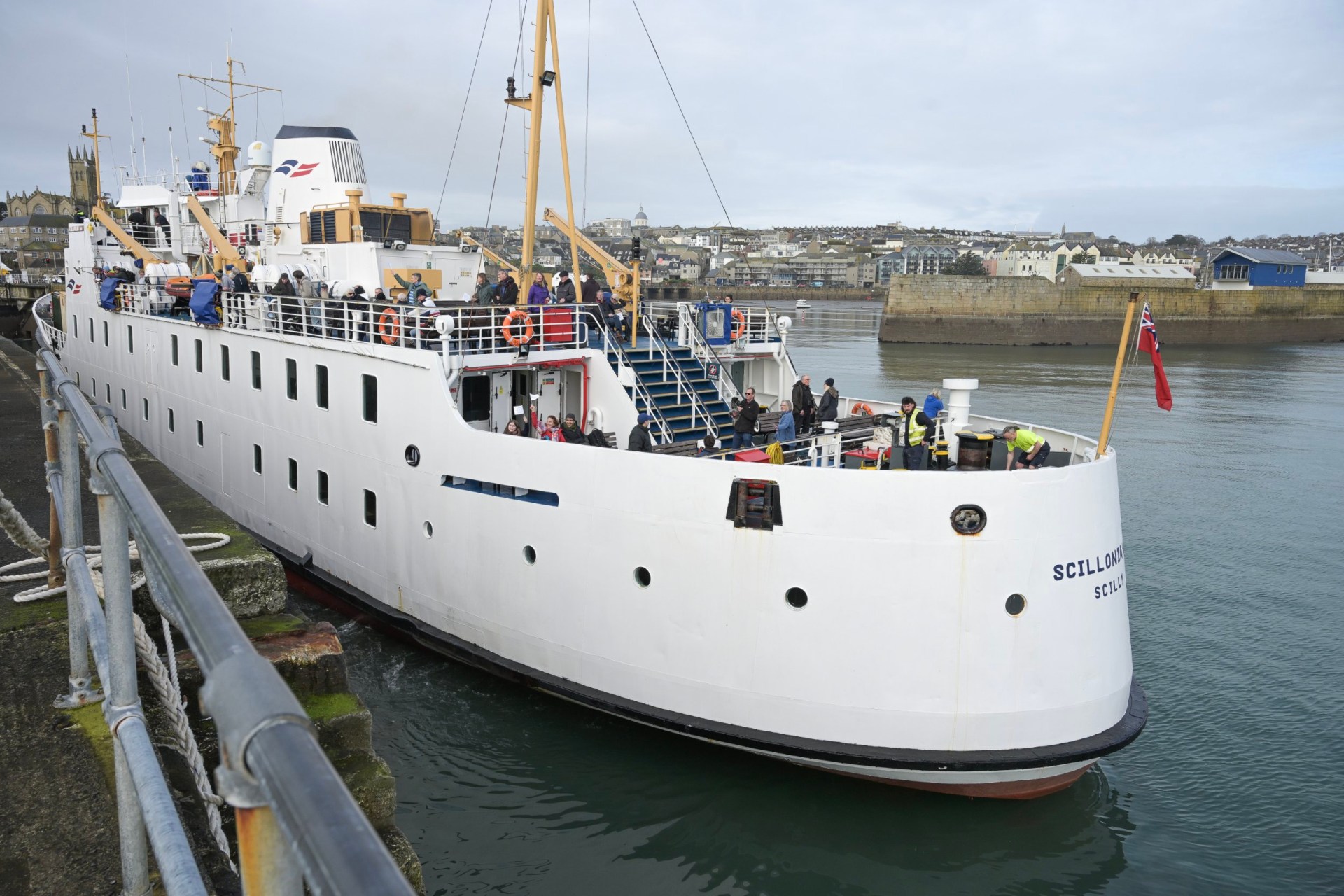 The Scillonian III ship moving away from the dock in Cornwall.