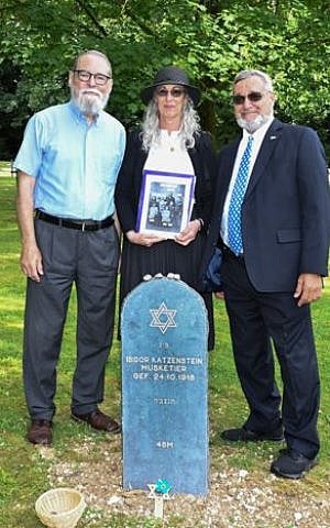 The author on the left, with his sister-in-law, Wendy, and brother, David, behind Isidor’s tombstone. Four stones were placed on the tombstone, three by us and the fourth by the Secretary General of the Volksbund, Dirk Backen.