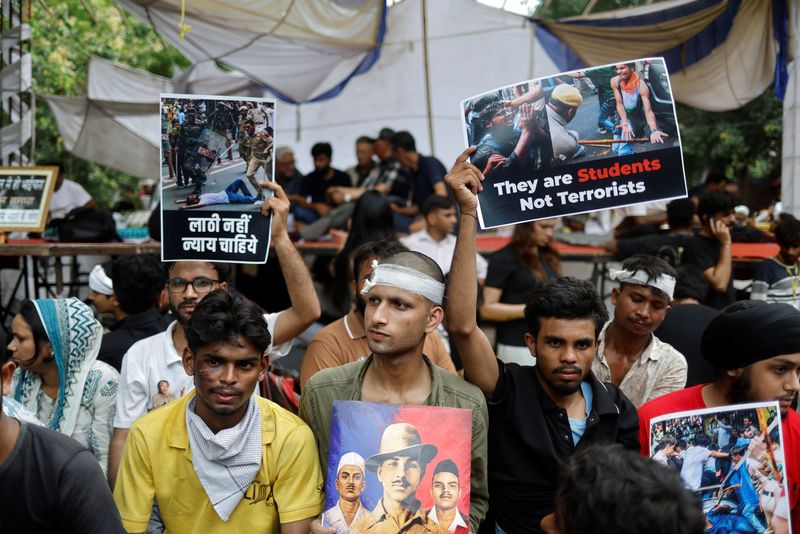 Supporters of India's Cockroach Janta Party (CJP) react at a protest site in New Delhi