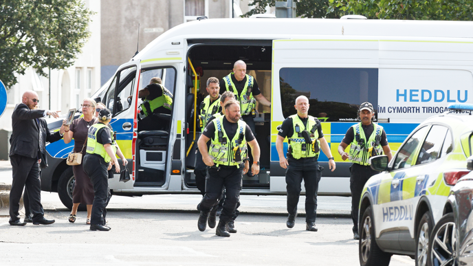 Police break up row after dead woman's family confront mechanic who falsified MOT