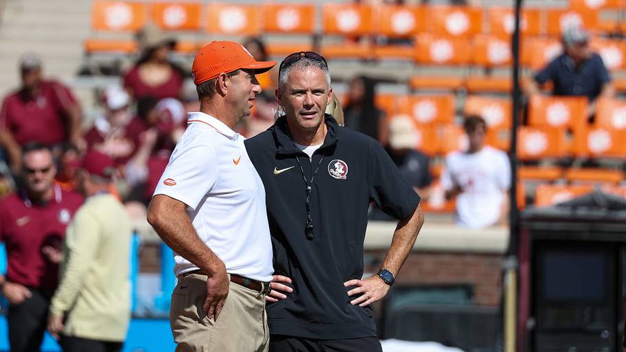 Clemson Tigers head coach Dabo Swinney talks with Florida State Seminoles head coach Mike Norvell at Memorial Stadium.