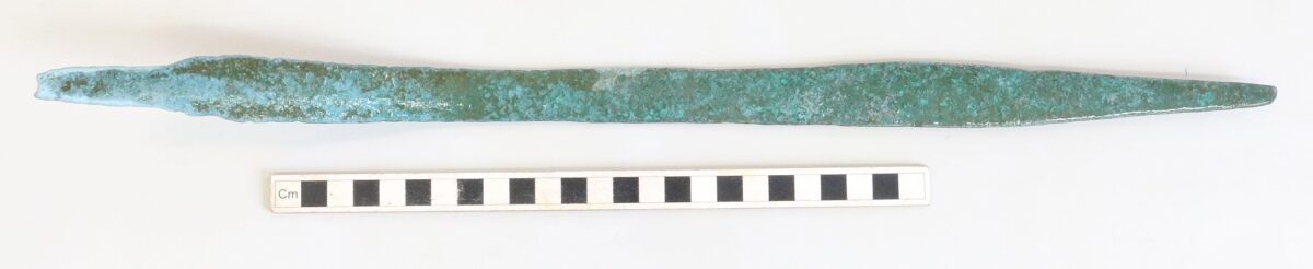 Bronze Age sword shown with a measurement scale. Credit: South West Maritime Archaeological Group
