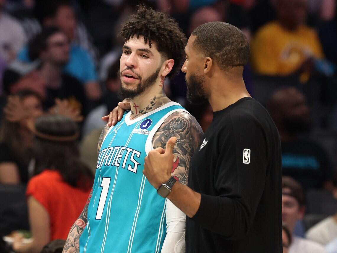 Charlotte Hornets head coach Charles Lee, right, speaks with guard LaMelo Ball after relieving him from the game during action against the Phoenix Suns at Spectrum Center in Charlotte, NC on Thursday, April 2, 2026.