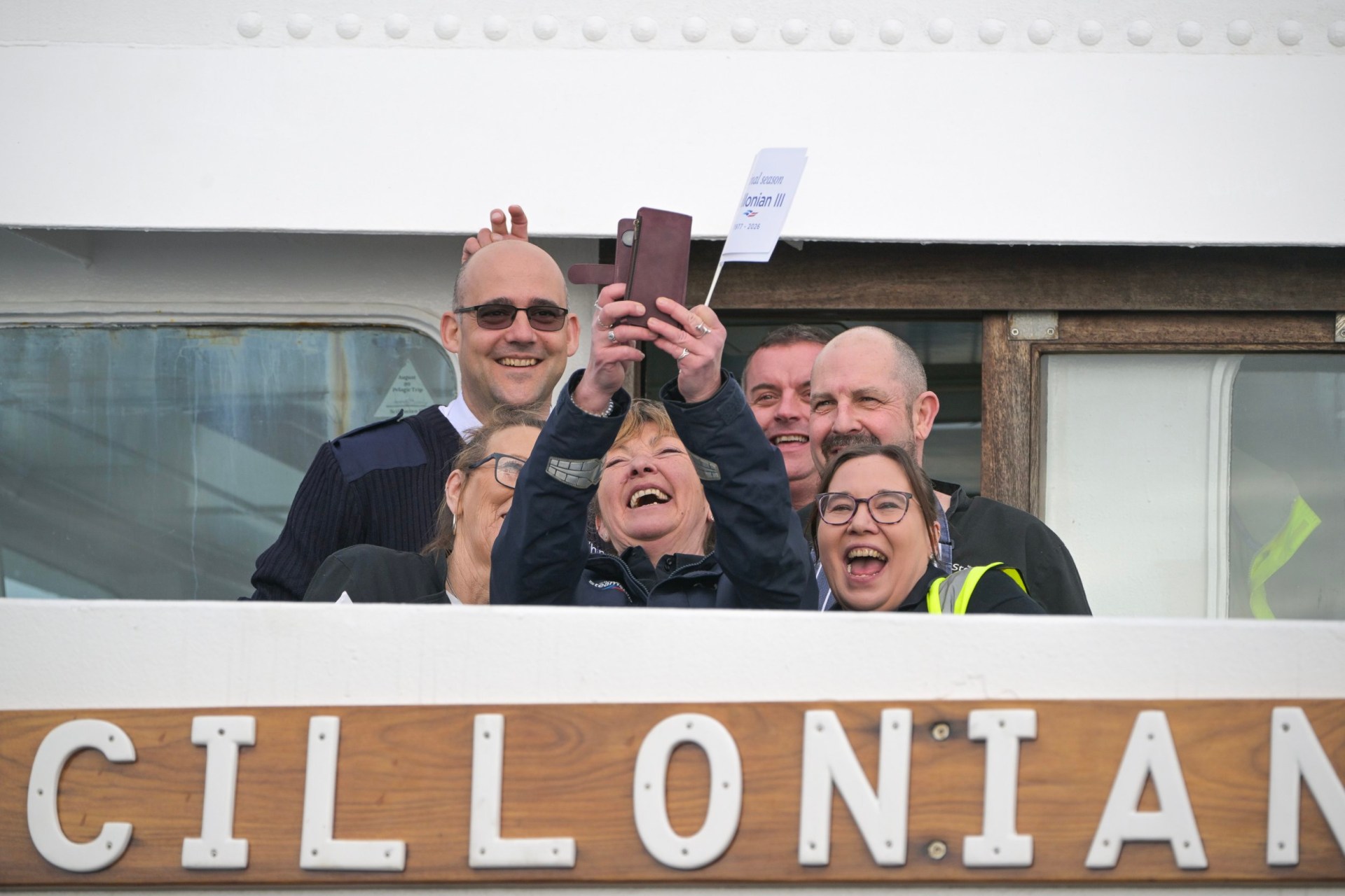 Members of the Isles Of Scilly Steamship Company's staff celebrating by taking a selfie of the Scillonian III deck.