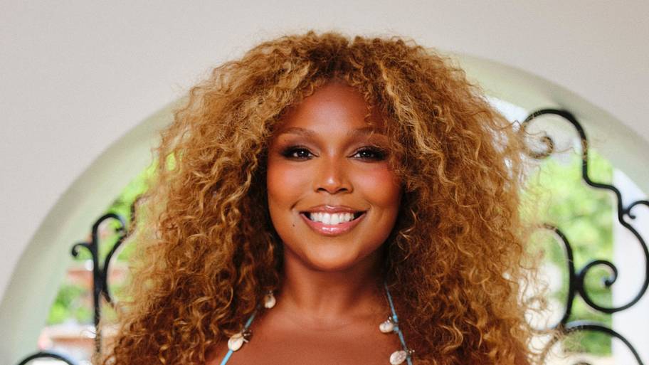 Lizzo was photographed by Robin Harper in Miami. Swimsuit by Oisri.