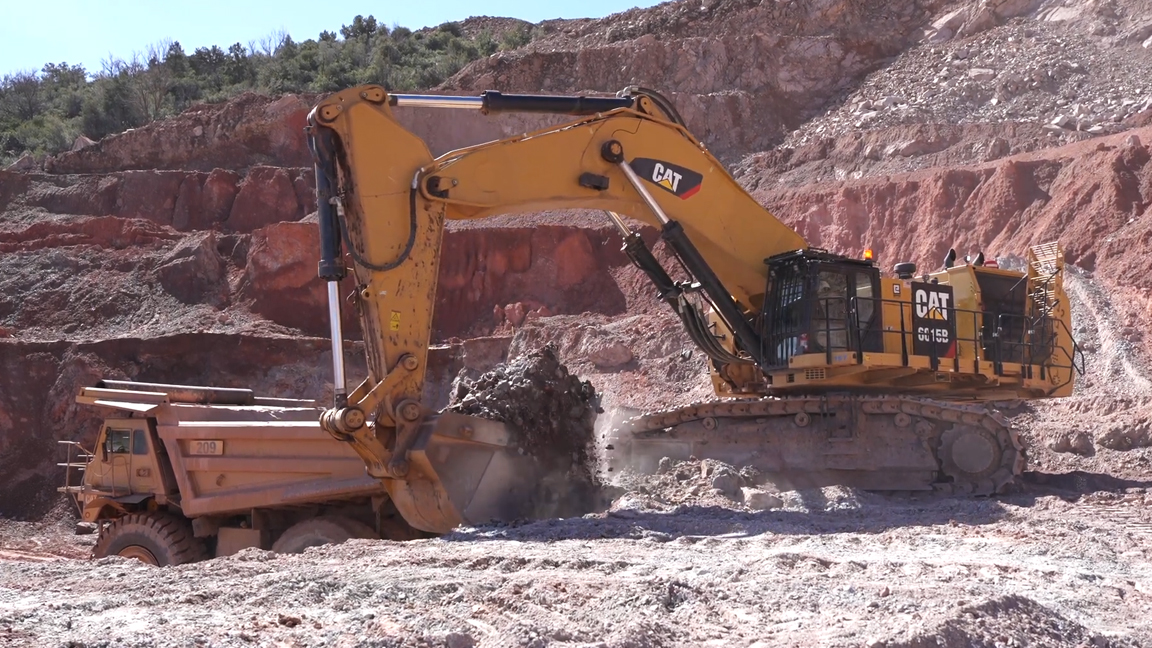 Giant excavator moves tons of rock in an epic mining operation