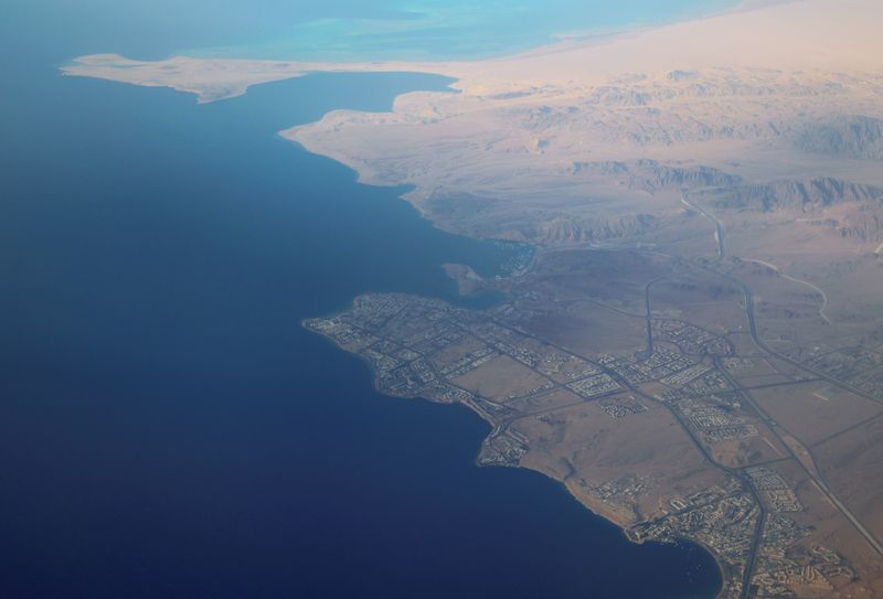 An aerial view of the coast of the Red Sea is seen through the window of an Egyptair airplane, near Sharm el-Sheikh