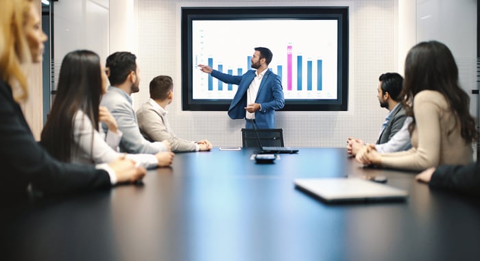 People at a business meeting reviewing results.